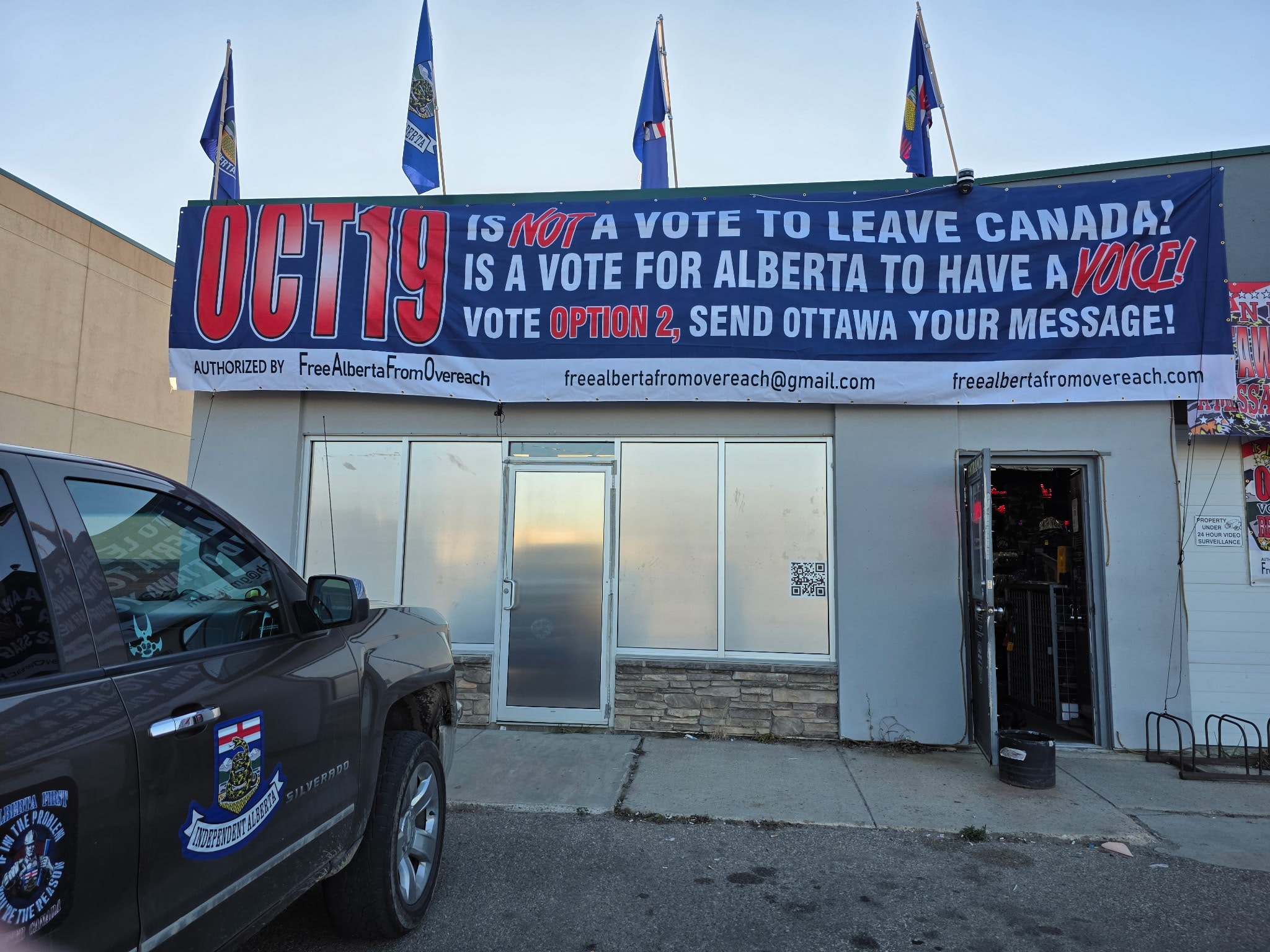 Vote Option 2 Send Ottawa Your Message banner on storefront with Alberta flags