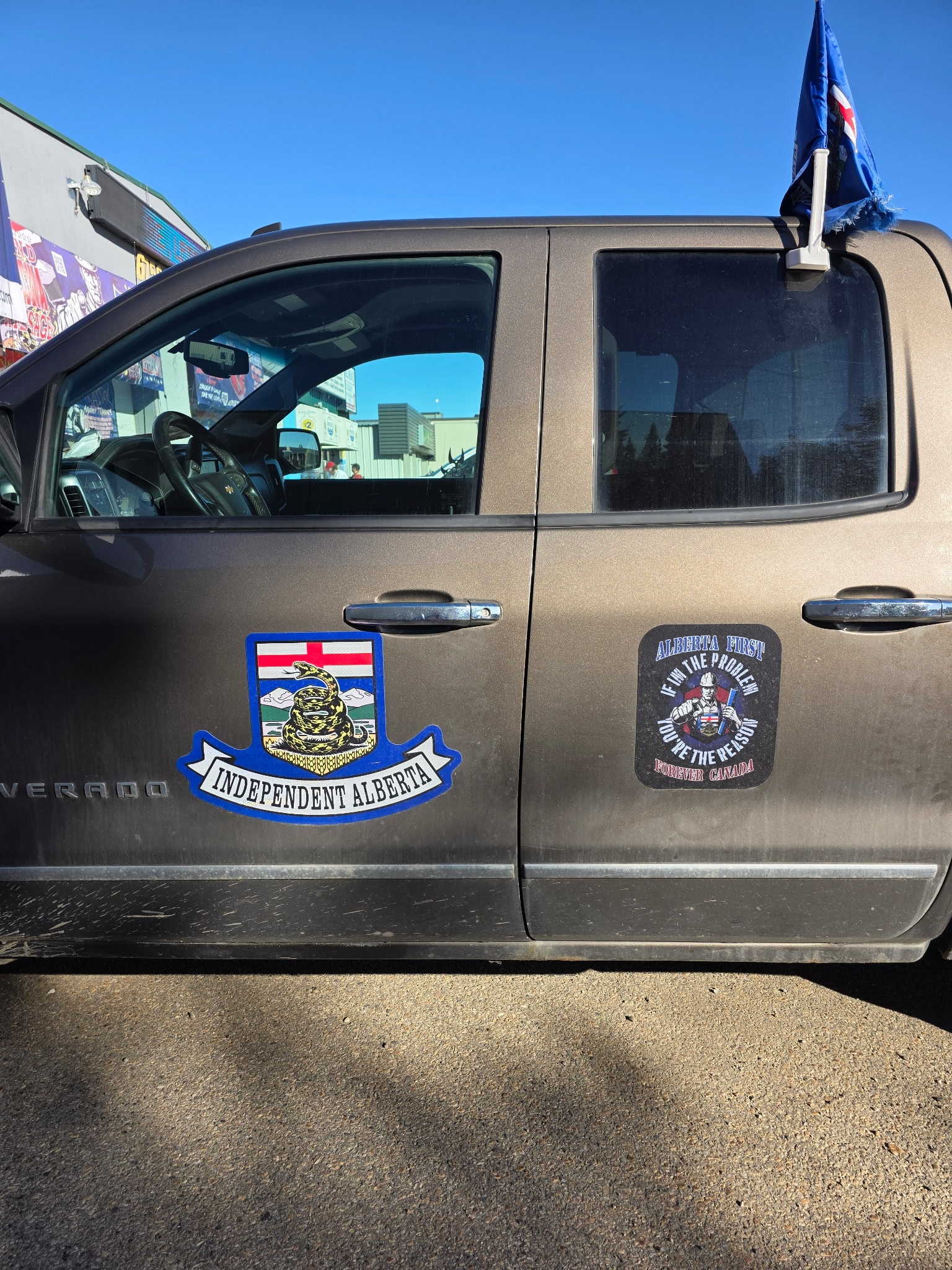 Independent Alberta truck with campaign stickers and Alberta flag