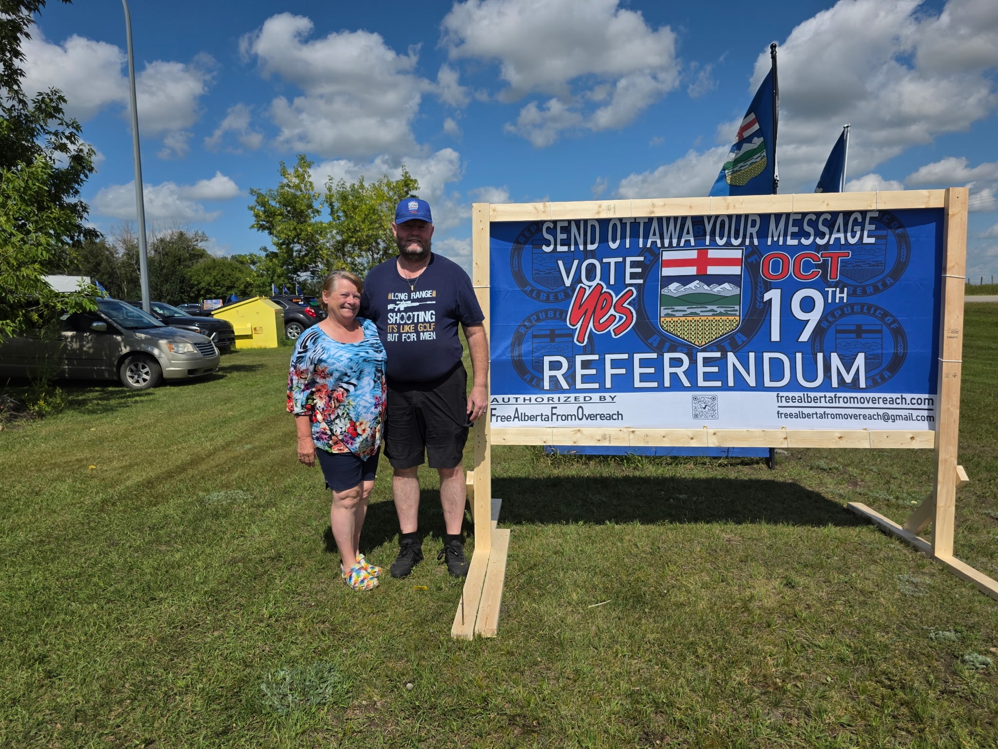 Couple standing with Vote Yes Referendum sign